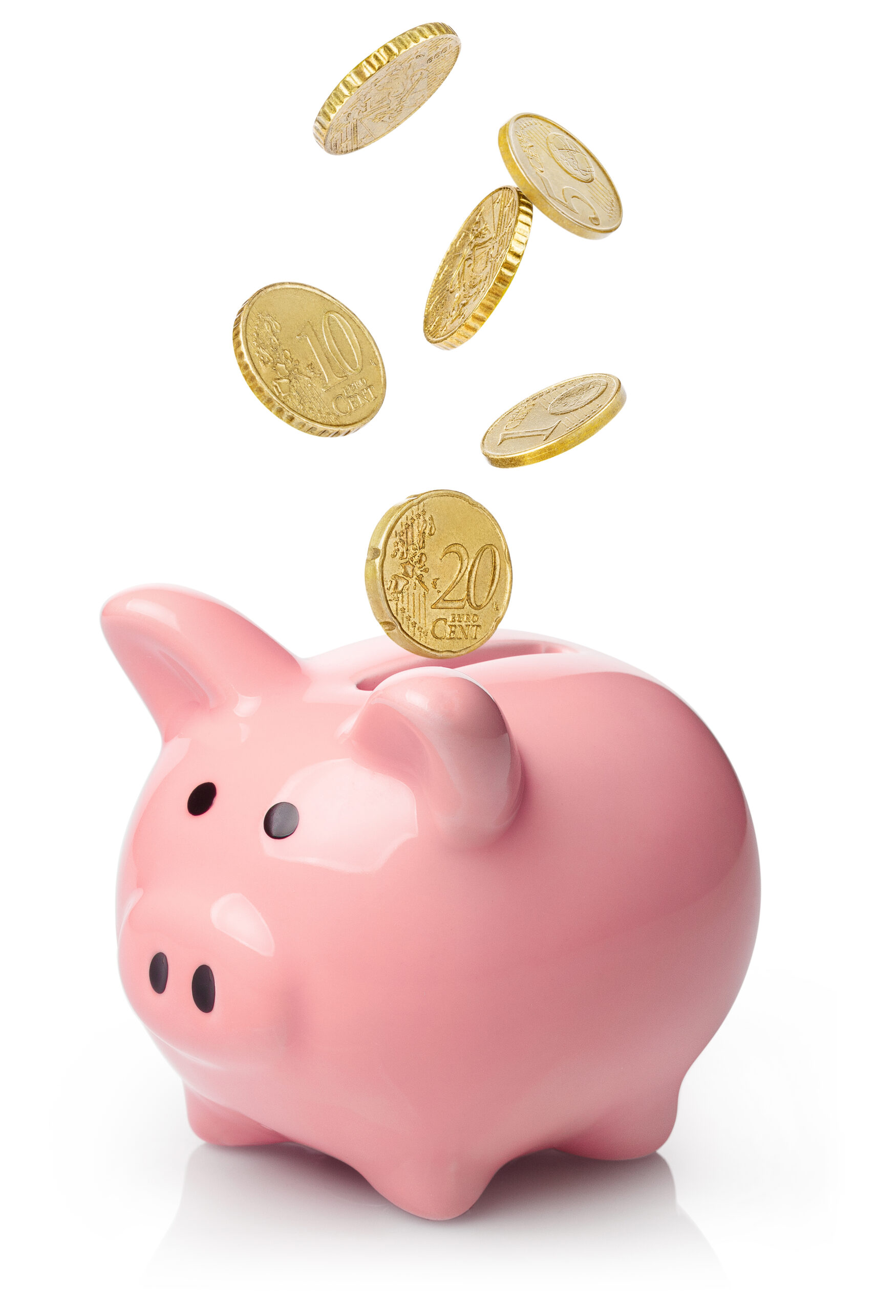 Pink piggy bank with falling coins, isolated on white background
